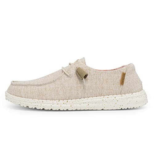 Beige casual shoe with white sole, side view.