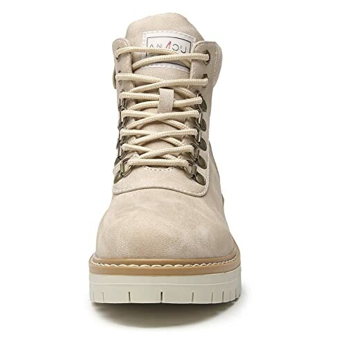 Front view of a beige lace-up boot with a sturdy sole.