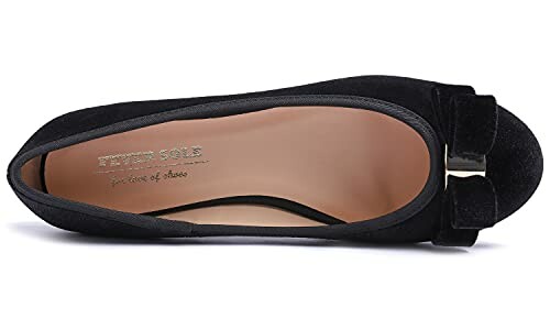 Top view of a black ballet flat shoe with a bow