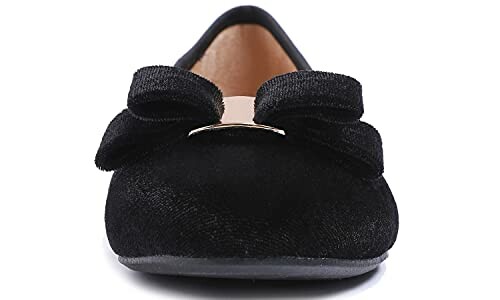 Front view of a black ballet flat shoe with a bow