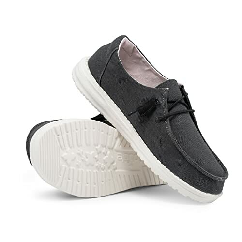 Pair of black casual shoes with white soles