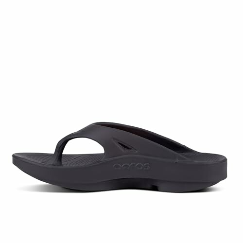 Side view of a black flip flop sandal