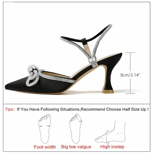 Black high heel shoe with rhinestone strap and heel height measurement.