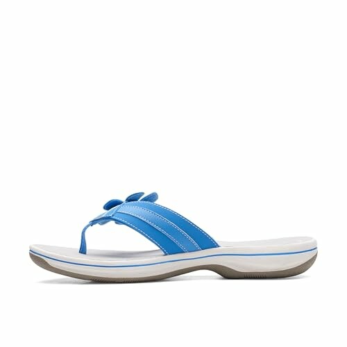 Blue flip flop sandal with a white and gray sole