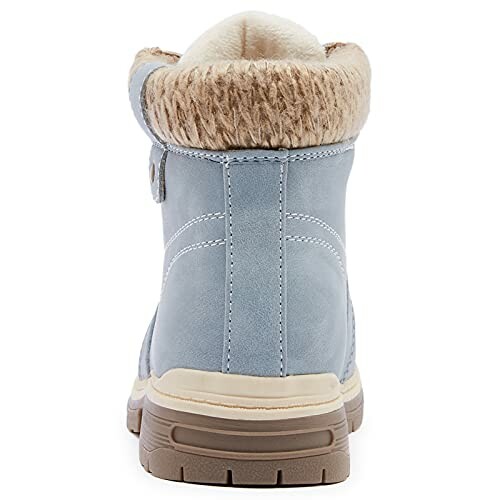 Blue winter boot with fur lining and rugged sole.