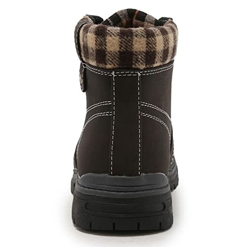 Back view of a brown ankle boot with plaid lining.