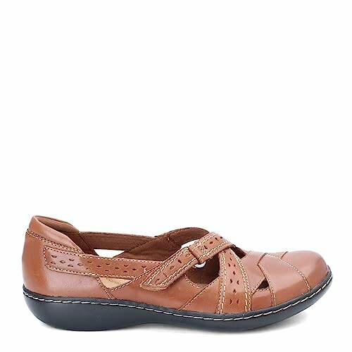 Brown leather women's sandal with strap and cutout design.