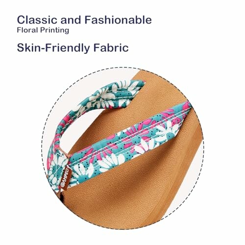 Close-up of a floral fabric bag strap with text 'Classic and Fashionable, Skin-Friendly Fabric'.