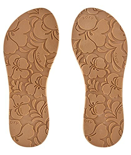 Pair of sandal soles with floral pattern.