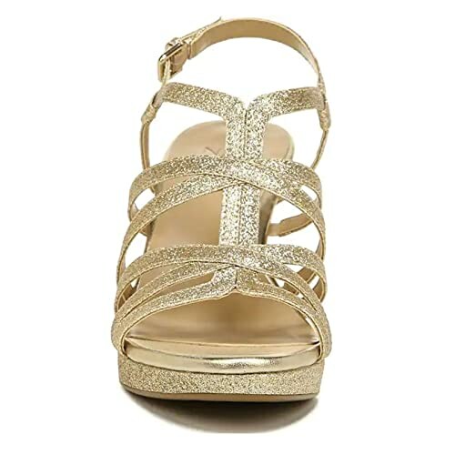 Front view of a gold glitter strappy sandal with a buckle strap.