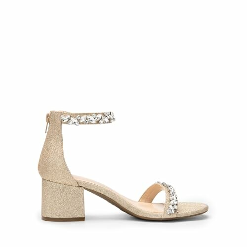 Gold block heel sandal with ankle strap and embellishments.