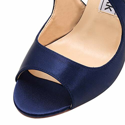 Close-up of a navy blue satin peep-toe heel shoe