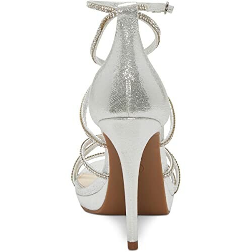 Rear view of a silver high heel sandal with ankle strap.