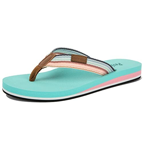 Colorful striped flip flop sandal with turquoise sole.