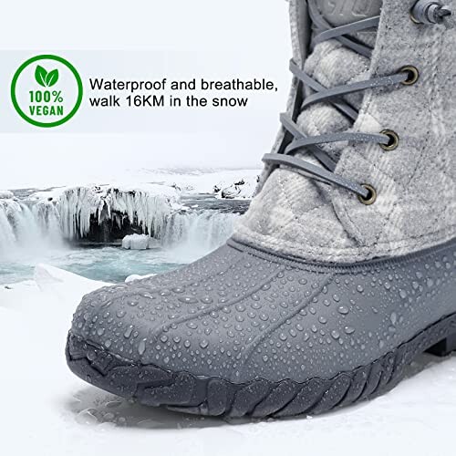 Close-up of a gray waterproof boot with droplets, snowy landscape in background, 100% vegan label.