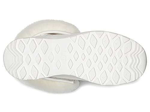 Bottom view of a white shoe sole with diamond pattern.