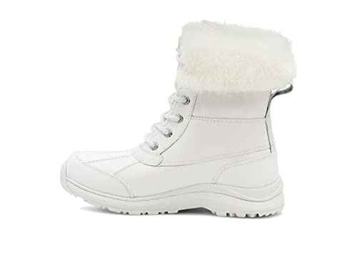 White winter boot with fur trim, side view.