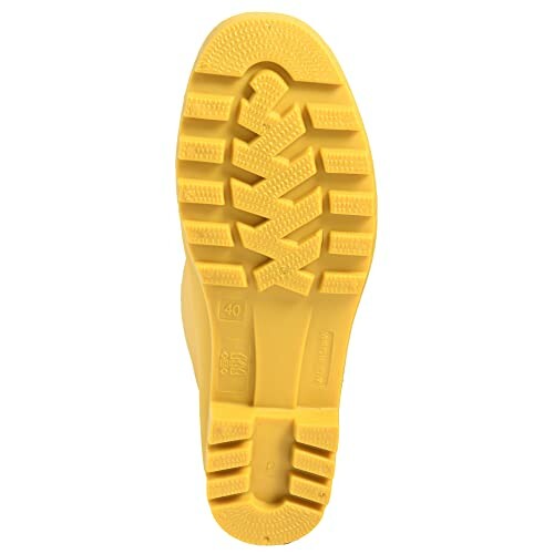 Yellow boot sole with tread pattern